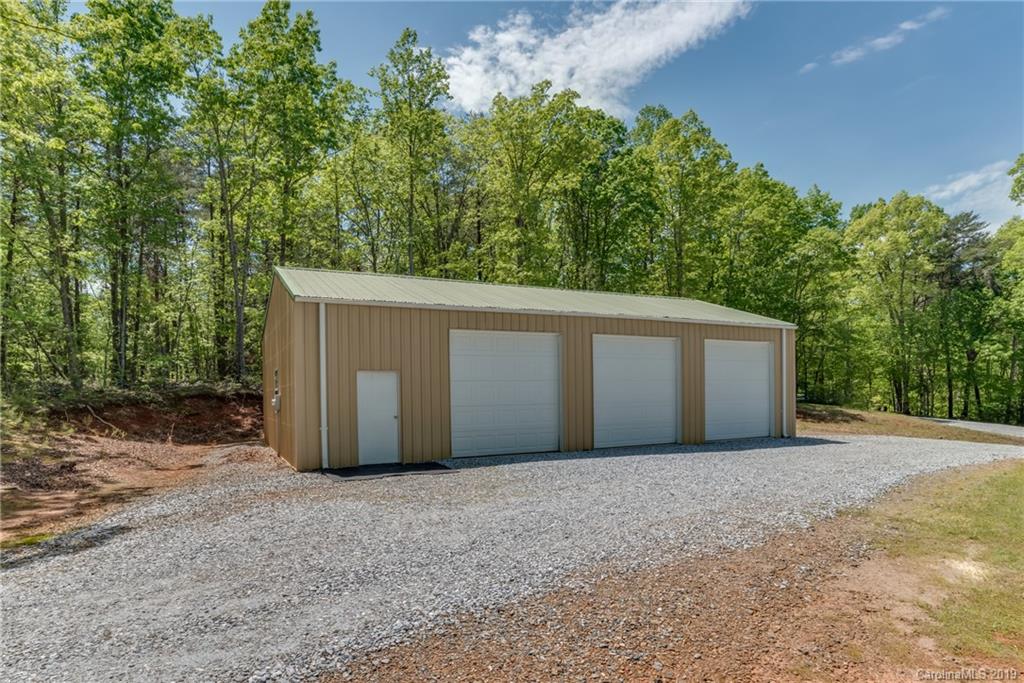 433 Meadow Crest Road Tryon, NC 28782 - Photo 3 of 29 a view of a garage with a barn