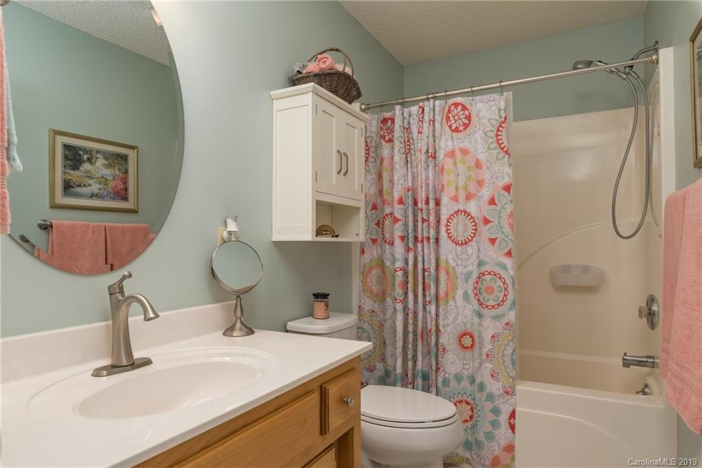 433 Meadow Crest Road Tryon, NC 28782 - Photo 21 of 29 a bathroom with a sink toilet and shower