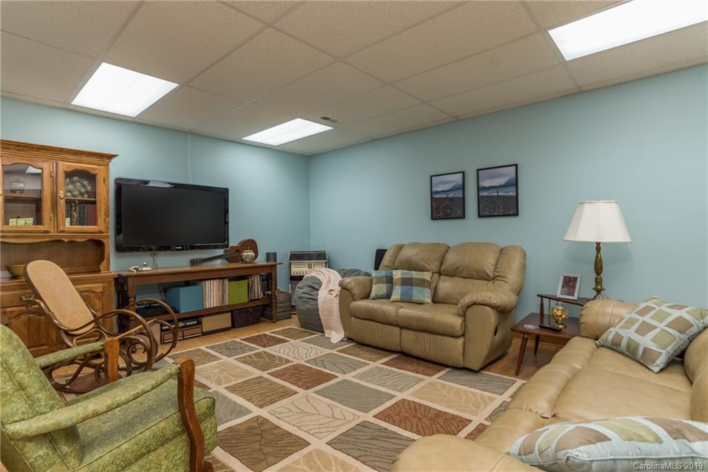 433 Meadow Crest Road Tryon, NC 28782 - Photo 23 of 29 a living room with furniture and a flat screen tv
