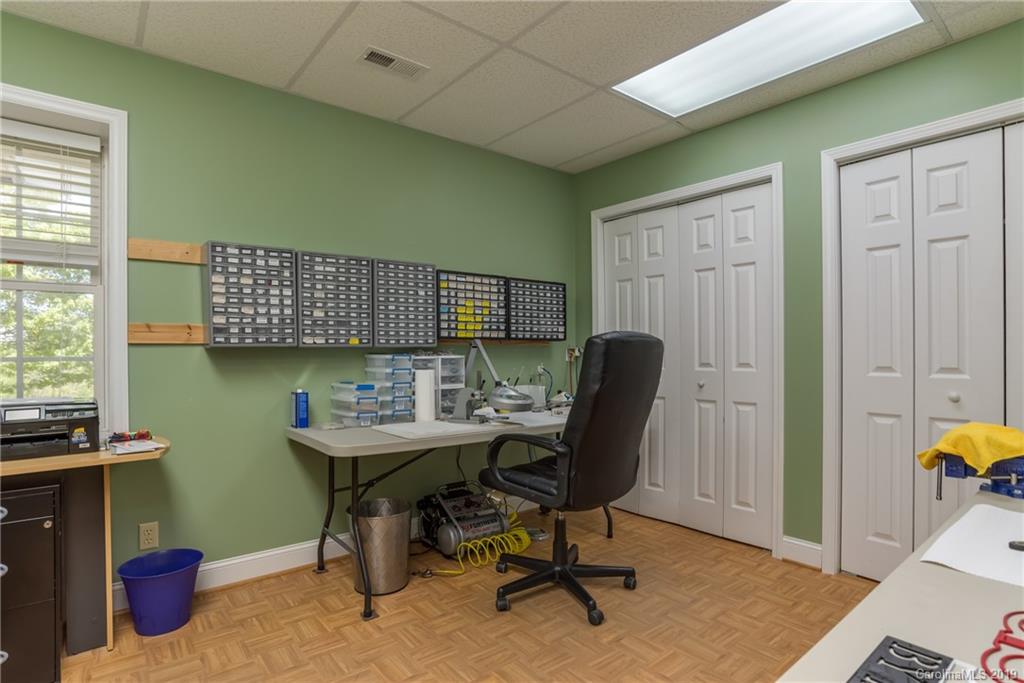 433 Meadow Crest Road Tryon, NC 28782 - Photo 26 of 29 a view of a workspace with furniture and a window