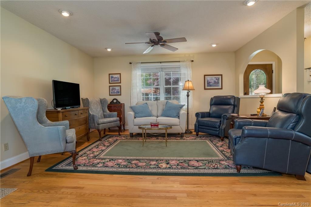 433 Meadow Crest Road Tryon, NC 28782 - Photo 10 of 29 a living room with furniture and a flat screen tv