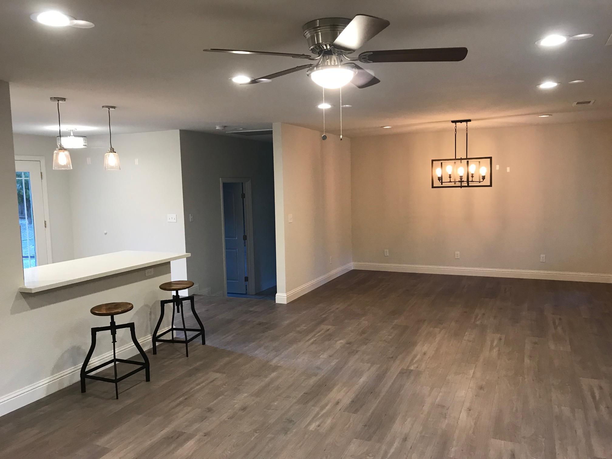 8500 Redbank Road Redding, CA 96001 - Photo 8 of 19 an empty room with wooden floor and windows