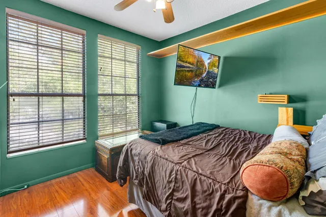 a bedroom with a bed and a window