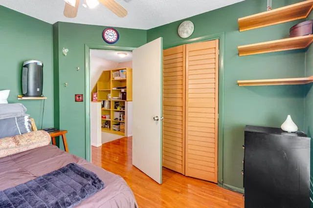 a bedroom with a bed and a dresser