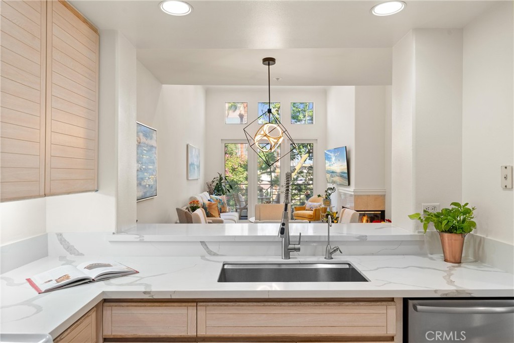 2243 Martin, Unit 415 Irvine, CA 92612 - Photo 11 of 34 a kitchen with a sink and a potted plant