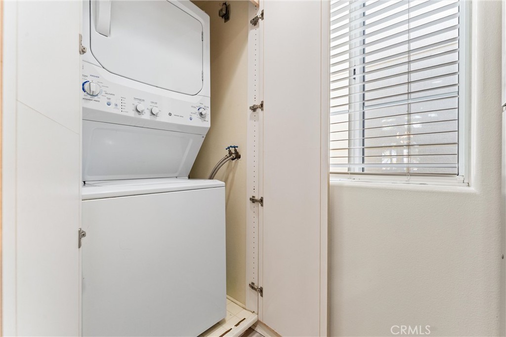 2243 Martin, Unit 415 Irvine, CA 92612 - Photo 12 of 34 a utility room with dryer and washer