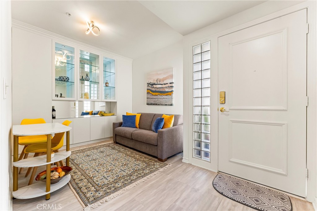 2243 Martin, Unit 415 Irvine, CA 92612 - Photo 14 of 34 a living room with furniture and a window
