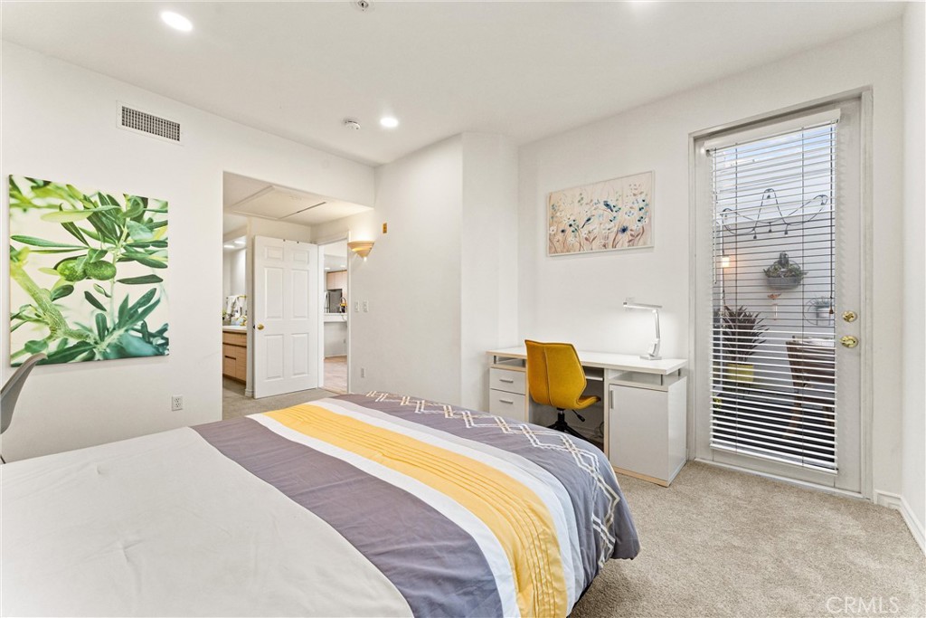2243 Martin, Unit 415 Irvine, CA 92612 - Photo 17 of 34 a bedroom with a bed and a window