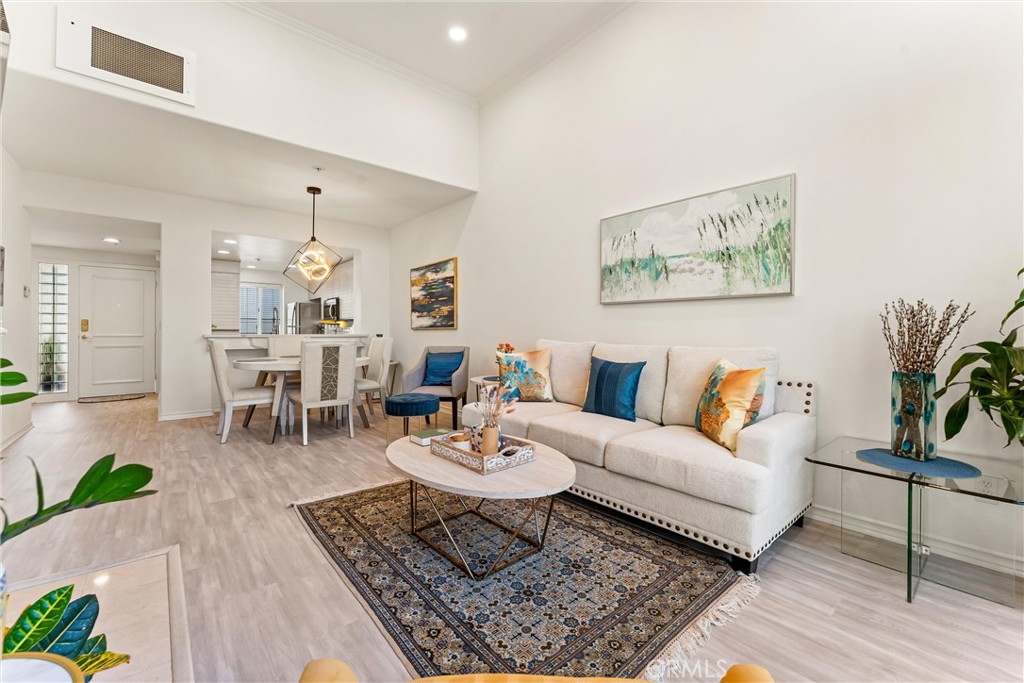 2243 Martin, Unit 415 Irvine, CA 92612 - Photo 22 of 34 a living room with furniture and wooden floor