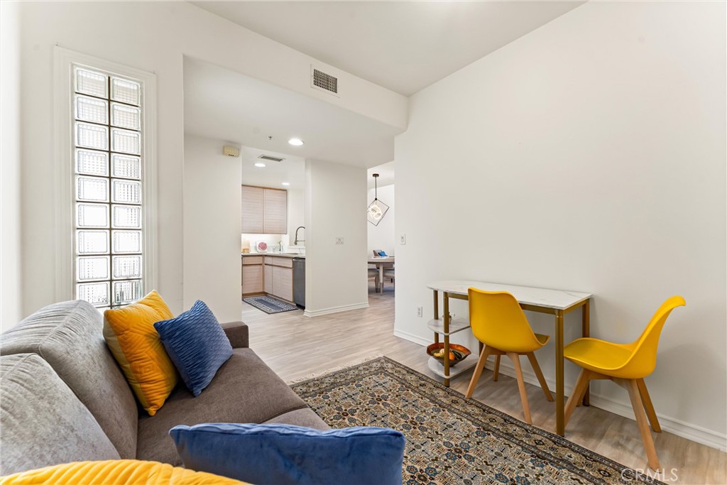 2243 Martin, Unit 415 Irvine, CA 92612 - Photo 24 of 34 a living room with furniture and kitchen view