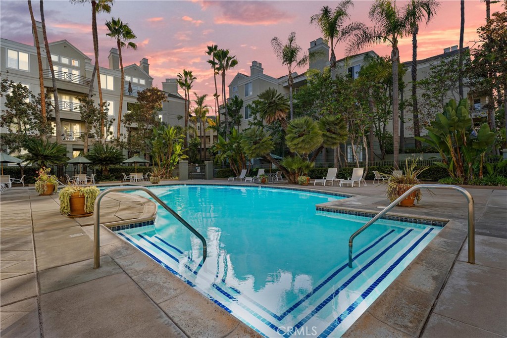 2243 Martin, Unit 415 Irvine, CA 92612 - Photo 32 of 34 a view of swimming pool with chairs and bench