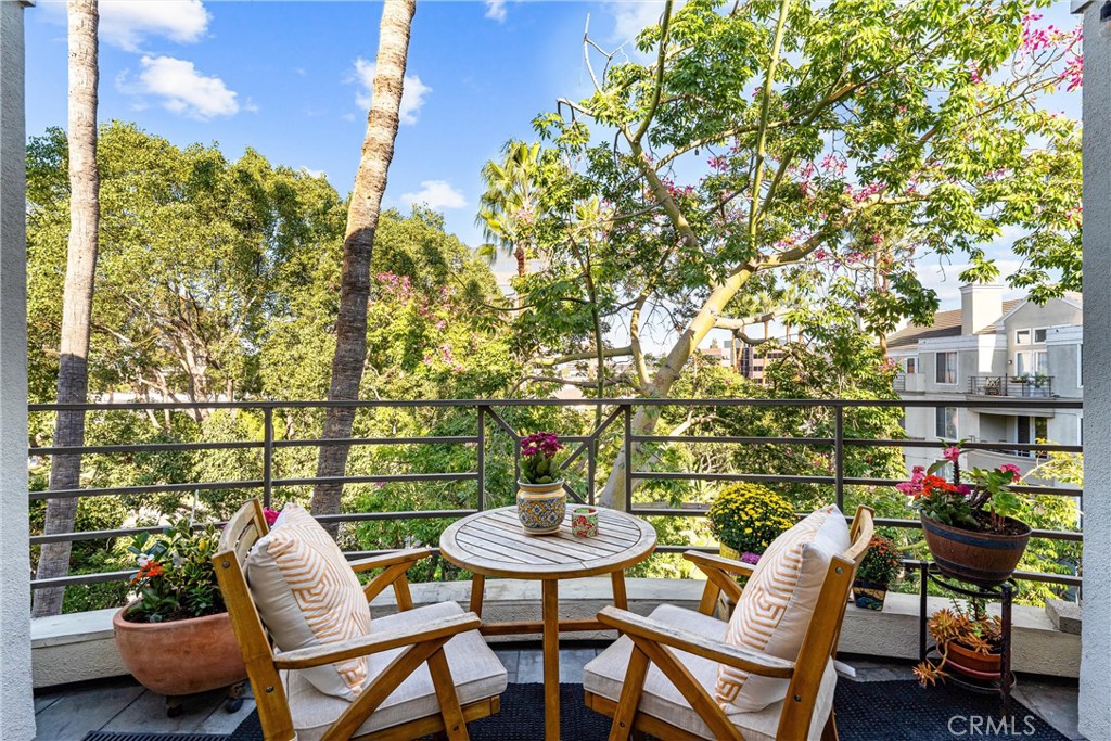 2243 Martin, Unit 415 Irvine, CA 92612 - Photo 5 of 34 a balcony with furniture and a potted plant