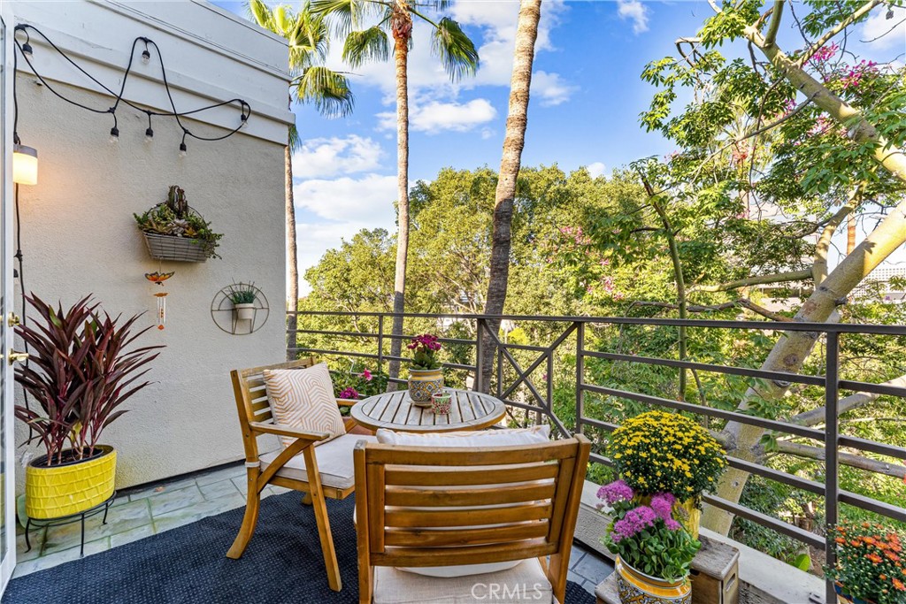 2243 Martin, Unit 415 Irvine, CA 92612 - Photo 6 of 34 a view of a chairs and table in a patio