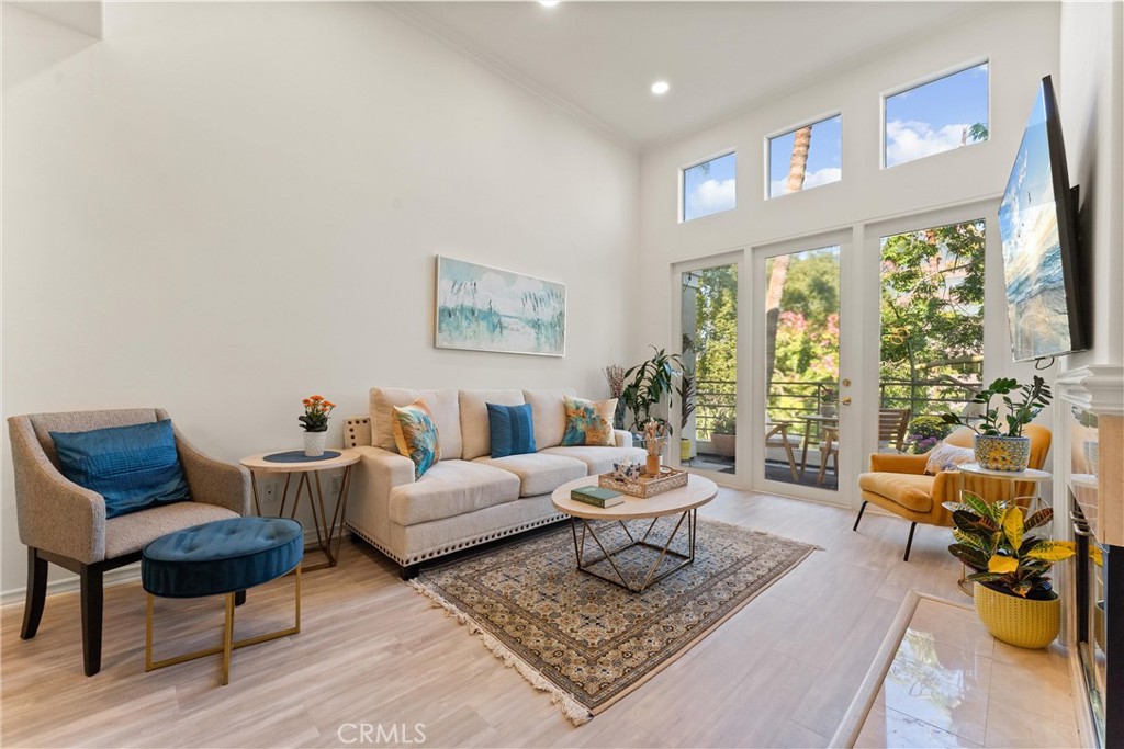 2243 Martin, Unit 415 Irvine, CA 92612 - Photo 7 of 34 a living room with furniture and a large window