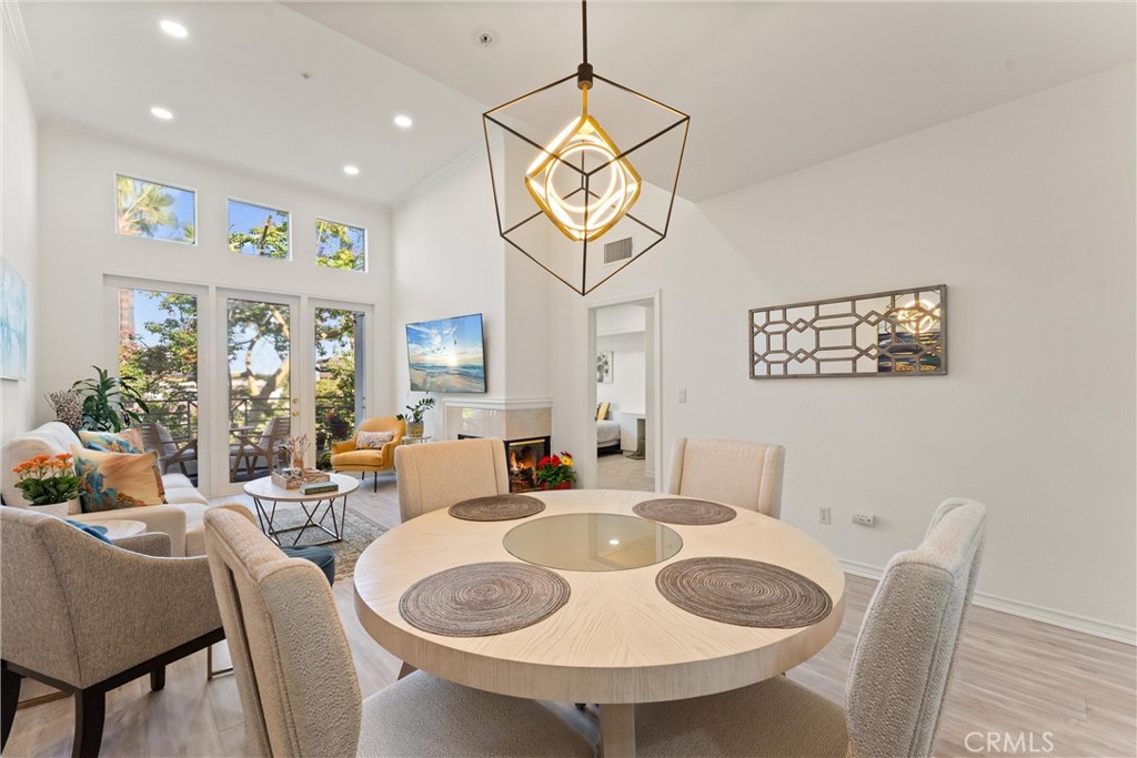 2243 Martin, Unit 415 Irvine, CA 92612 - Photo 8 of 34 a view of a dining room with furniture and a chandelier