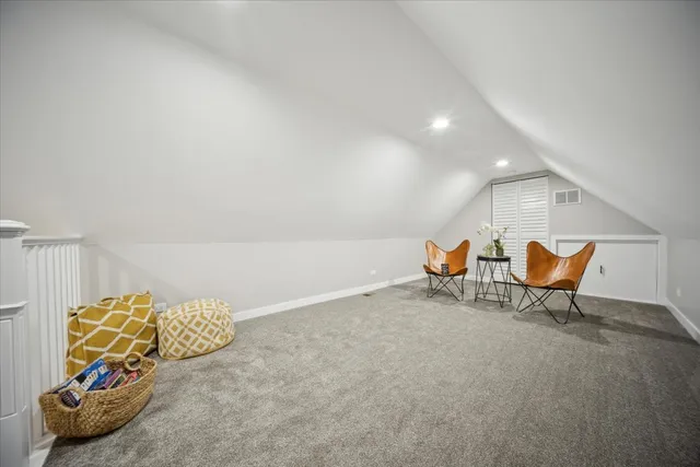 a view of a room with table and chairs