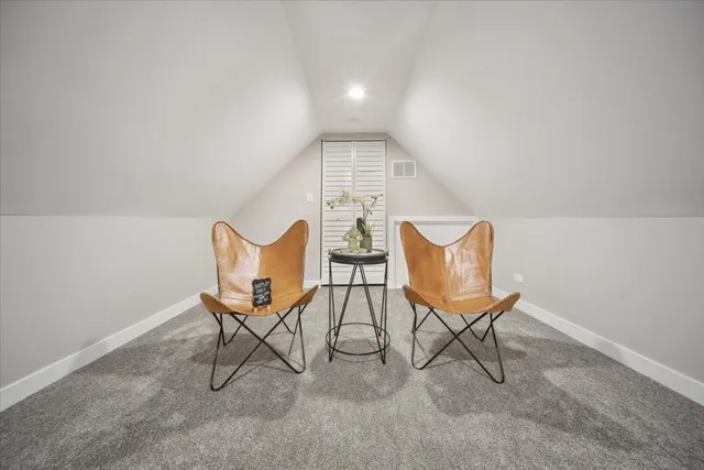 a view of a chairs and table in a room