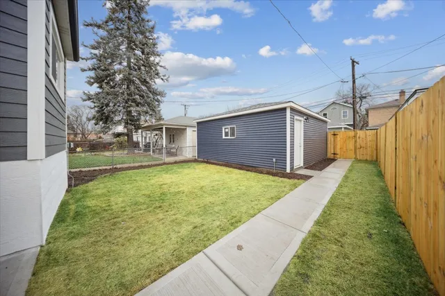 a view of a backyard of the house