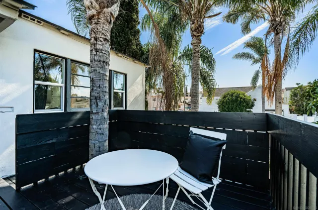 a view of a chairs and table in patio