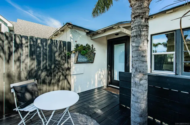 a view of a chairs and table in a patio