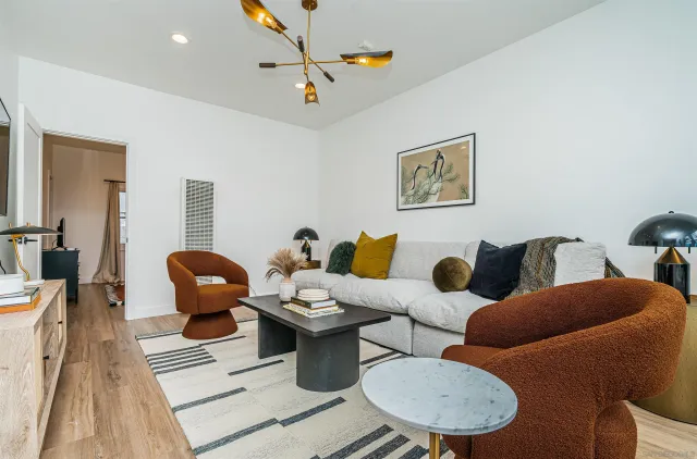 a kitchen with stainless steel appliances a refrigerator a sink and cabinets