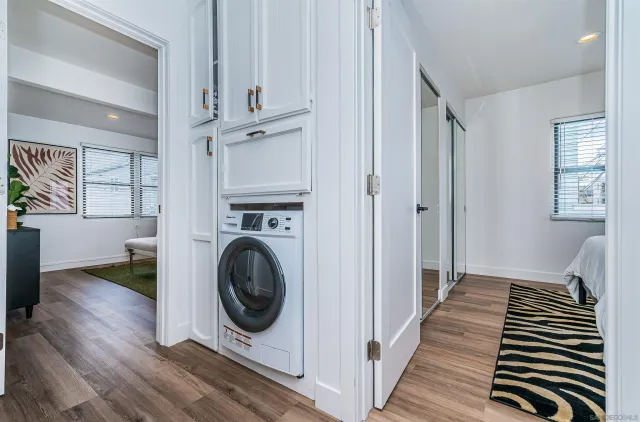 a view of a hallway with washer and dryer