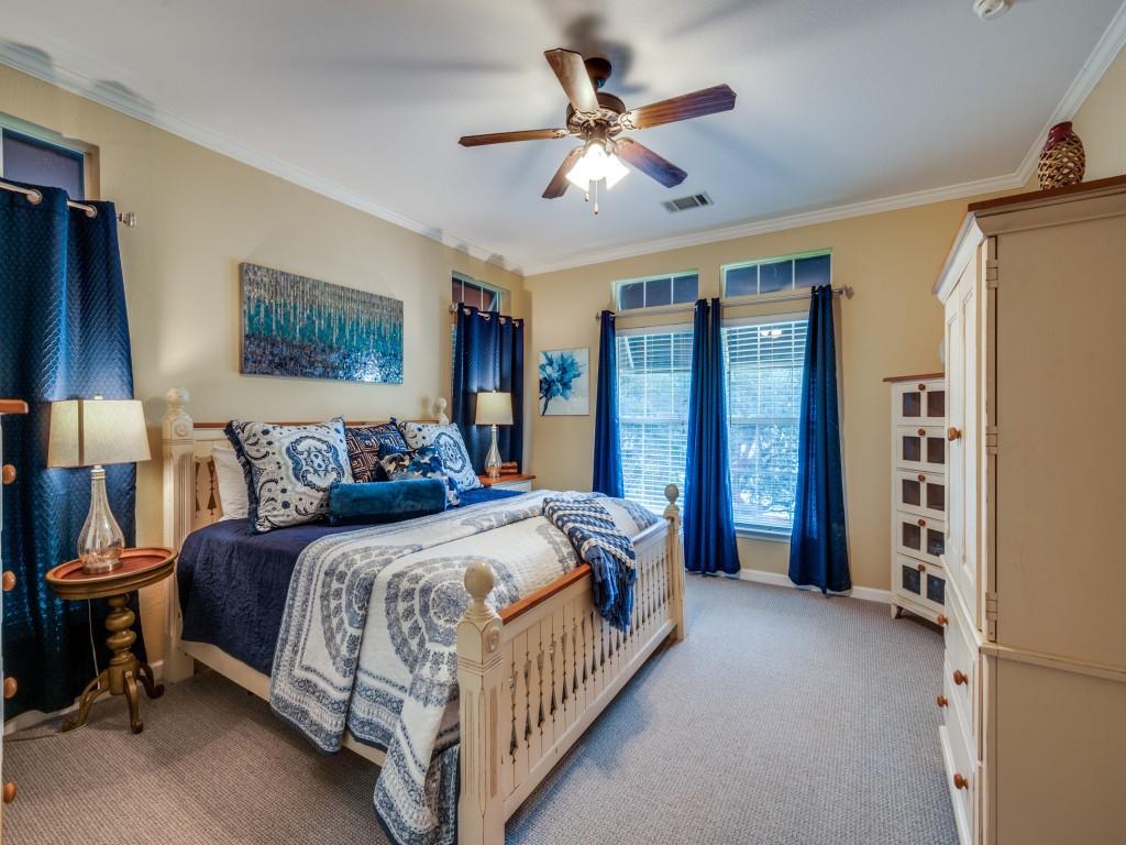 4925 Butler Lane Graham, TX 76450 - Photo 19 of 36 a bedroom with a bed chandelier and a window