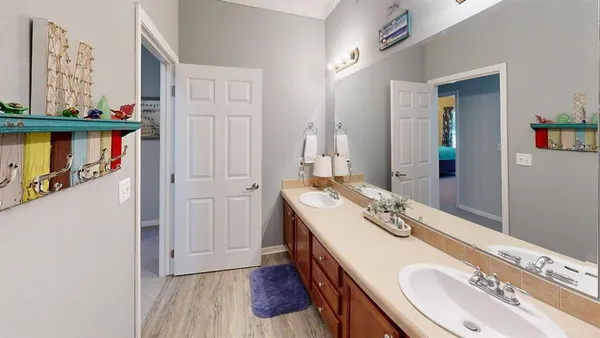 a kitchen with refrigerator and cabinets