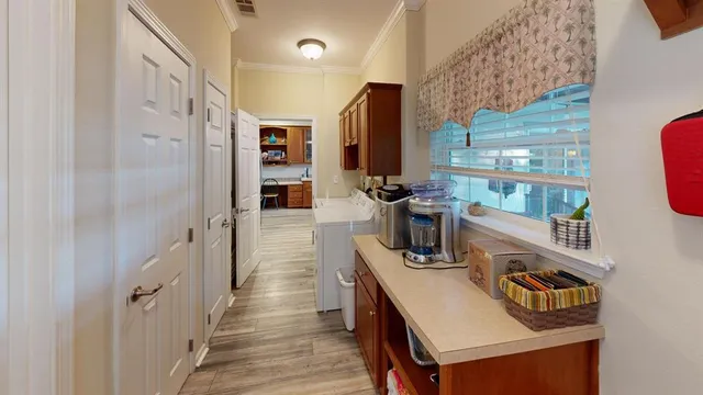 an aerial view of a house with a yard fire pit