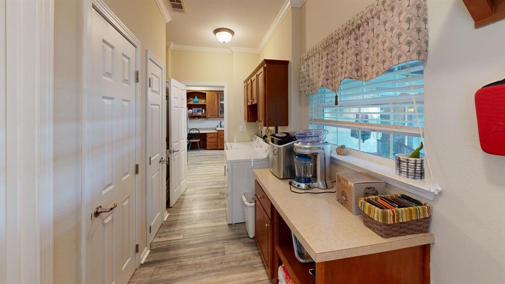 4925 Butler Lane Graham, TX 76450 - Photo 27 of 36 a kitchen with refrigerator and cabinets