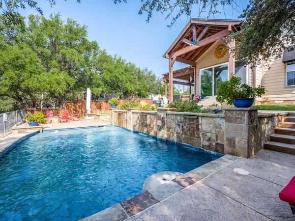 an aerial view of a house with swimming pool