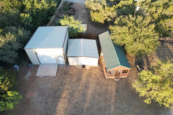 an aerial view of a house with a lake view