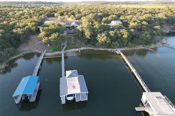 an aerial view of a house with a yard