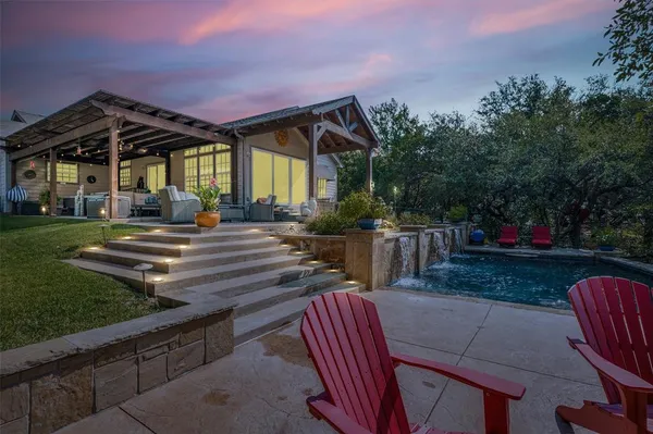 a view of a backyard with sitting area
