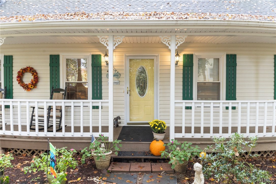 6810 Full Rack Circle Midlothian, VA 23112 - Photo 2 of 31 a front view of a house with outdoor seating and plants
