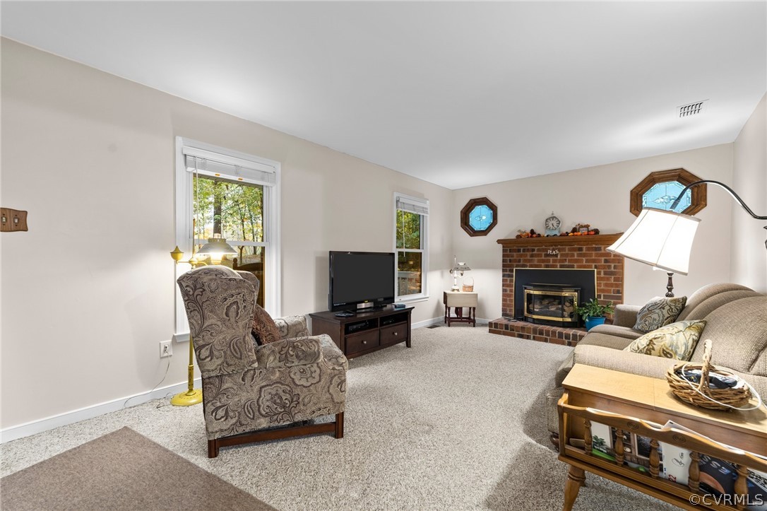 6810 Full Rack Circle Midlothian, VA 23112 - Photo 30 of 31 a living room with furniture a fireplace and a flat screen tv