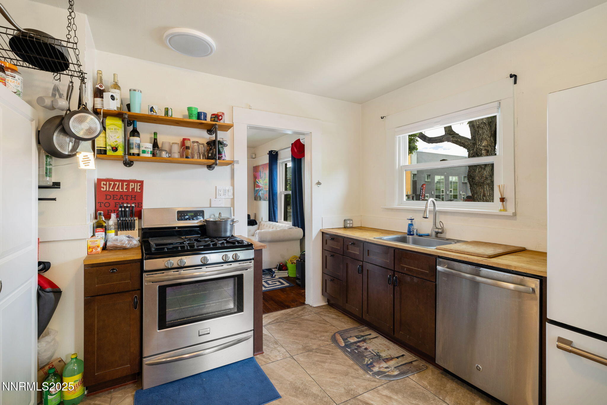 800 South Center Street Reno, NV 89501 - Photo 10 of 25 a kitchen with stainless steel appliances granite countertop a sink and wooden floor