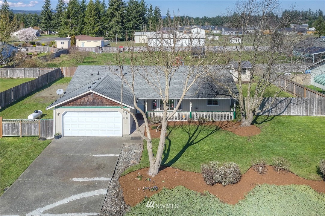 9320 181st Way Southwest Rochester, WA 98579 - Photo 2 of 21 an aerial view of a house with a yard