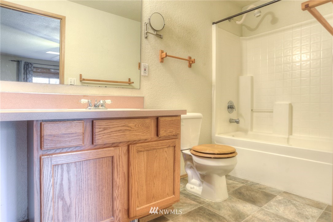 9320 181st Way Southwest Rochester, WA 98579 - Photo 14 of 21 a bathroom with a sink a toilet and shower