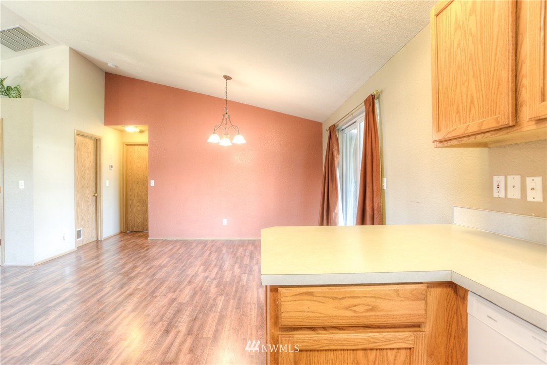 9320 181st Way Southwest Rochester, WA 98579 - Photo 8 of 21 a view of a room with wooden floor and a window