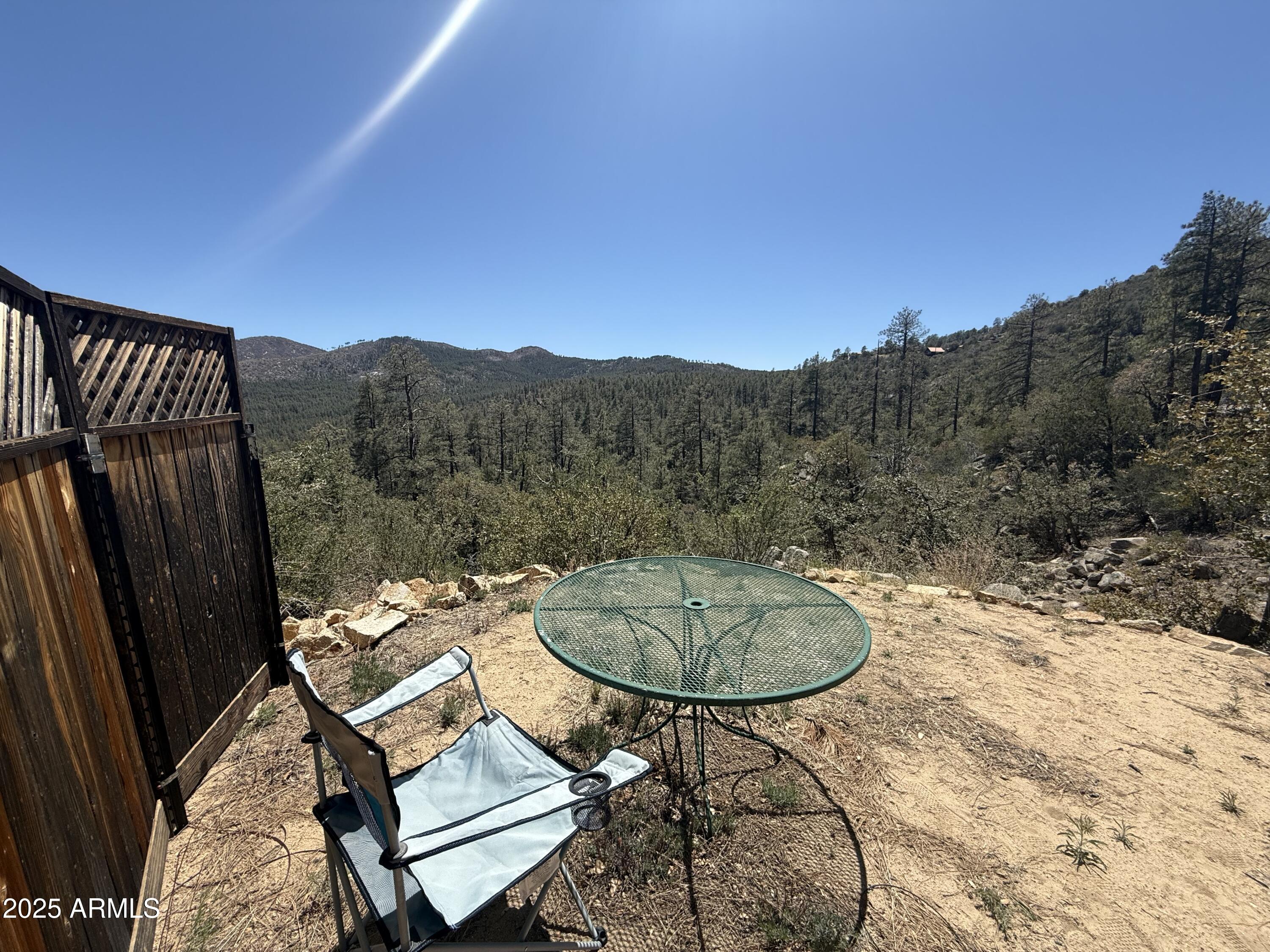 6937 Torpedo Road Crown King, AZ 86343 - Photo 11 of 23 a terrace of a house with table and chairs
