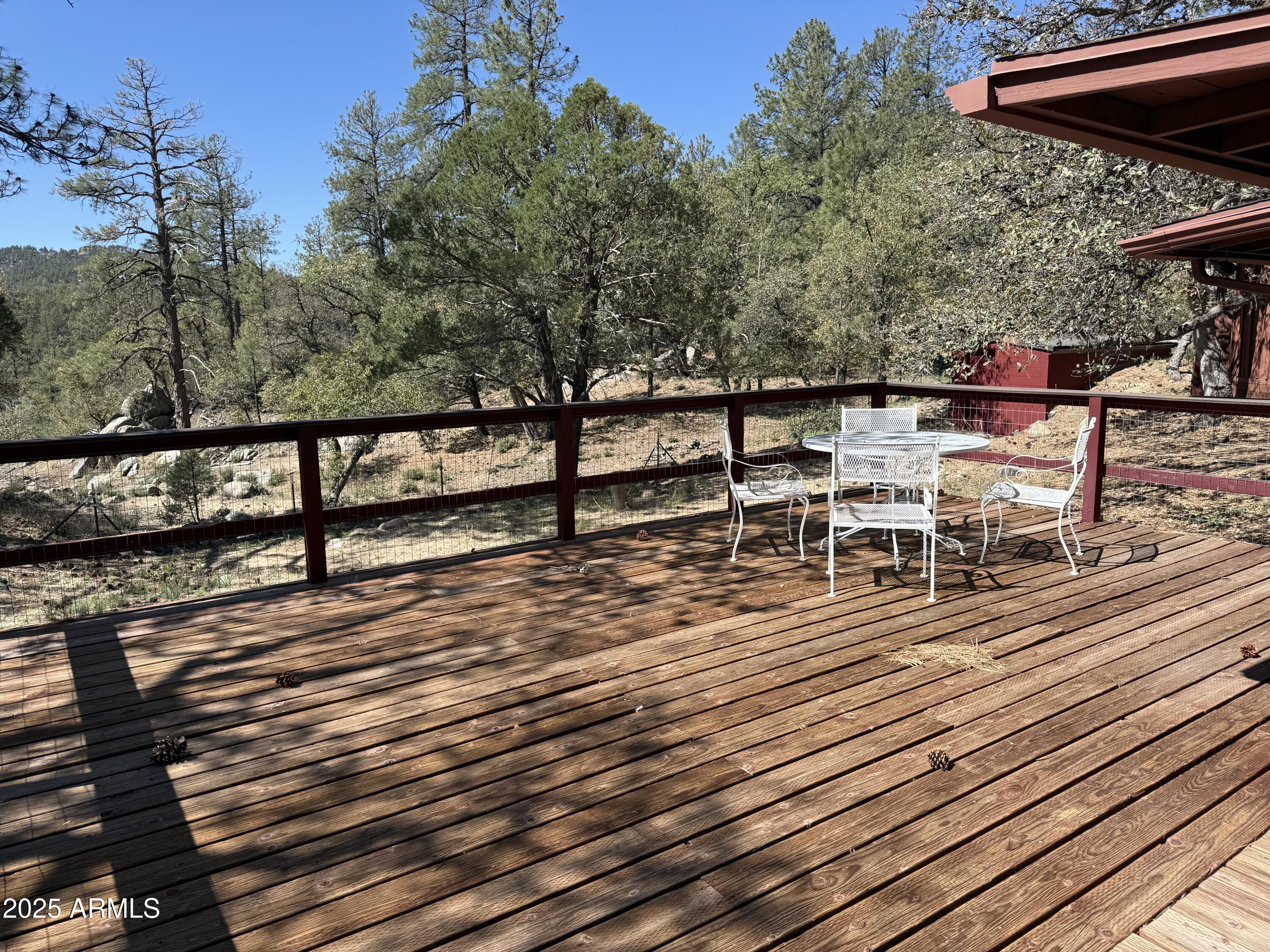 6937 Torpedo Road Crown King, AZ 86343 - Photo 16 of 23 a view of a terrace with wooden floor and outdoor seating