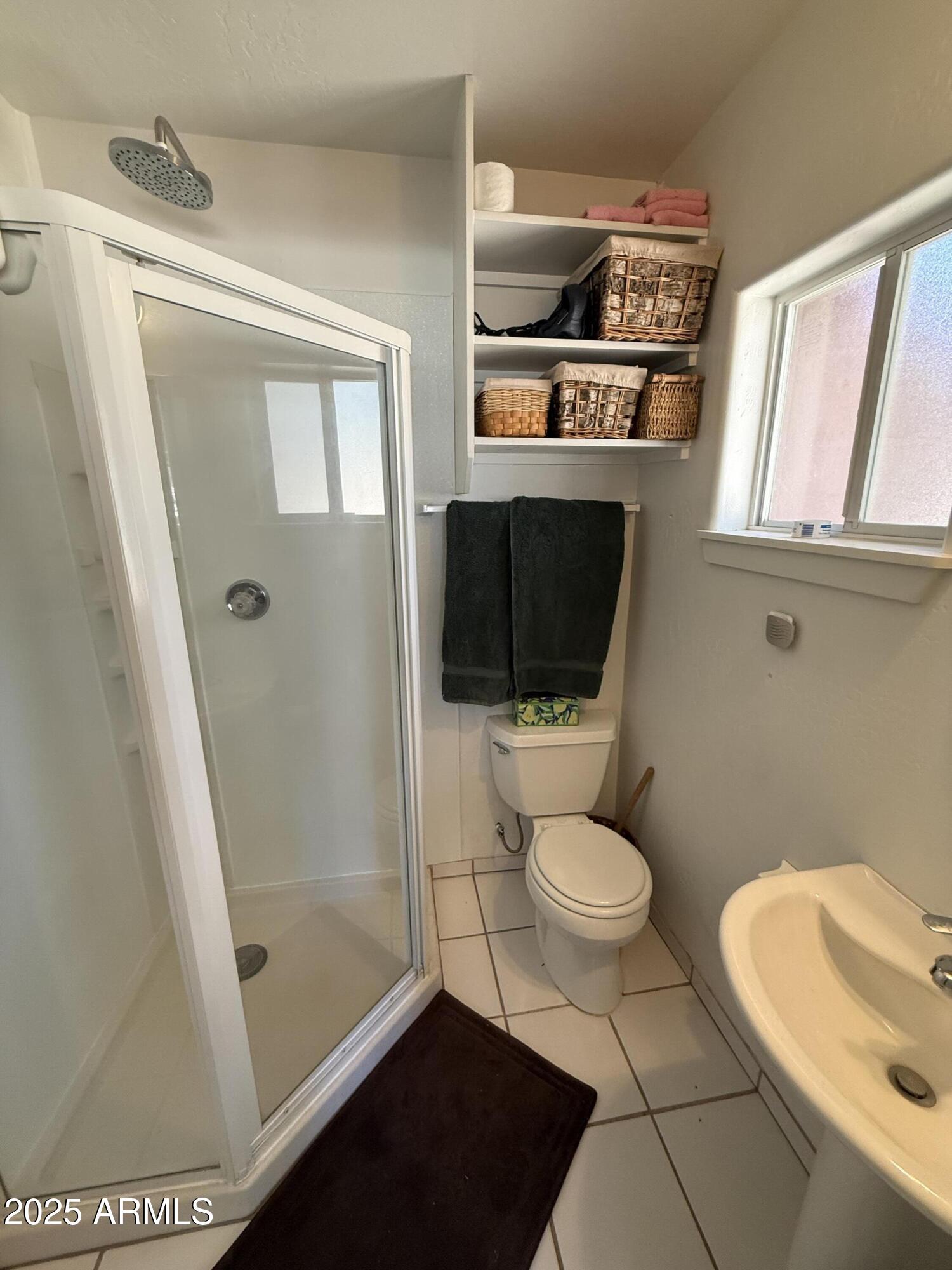 6937 Torpedo Road Crown King, AZ 86343 - Photo 19 of 23 a bathroom with a toilet a sink and a shower