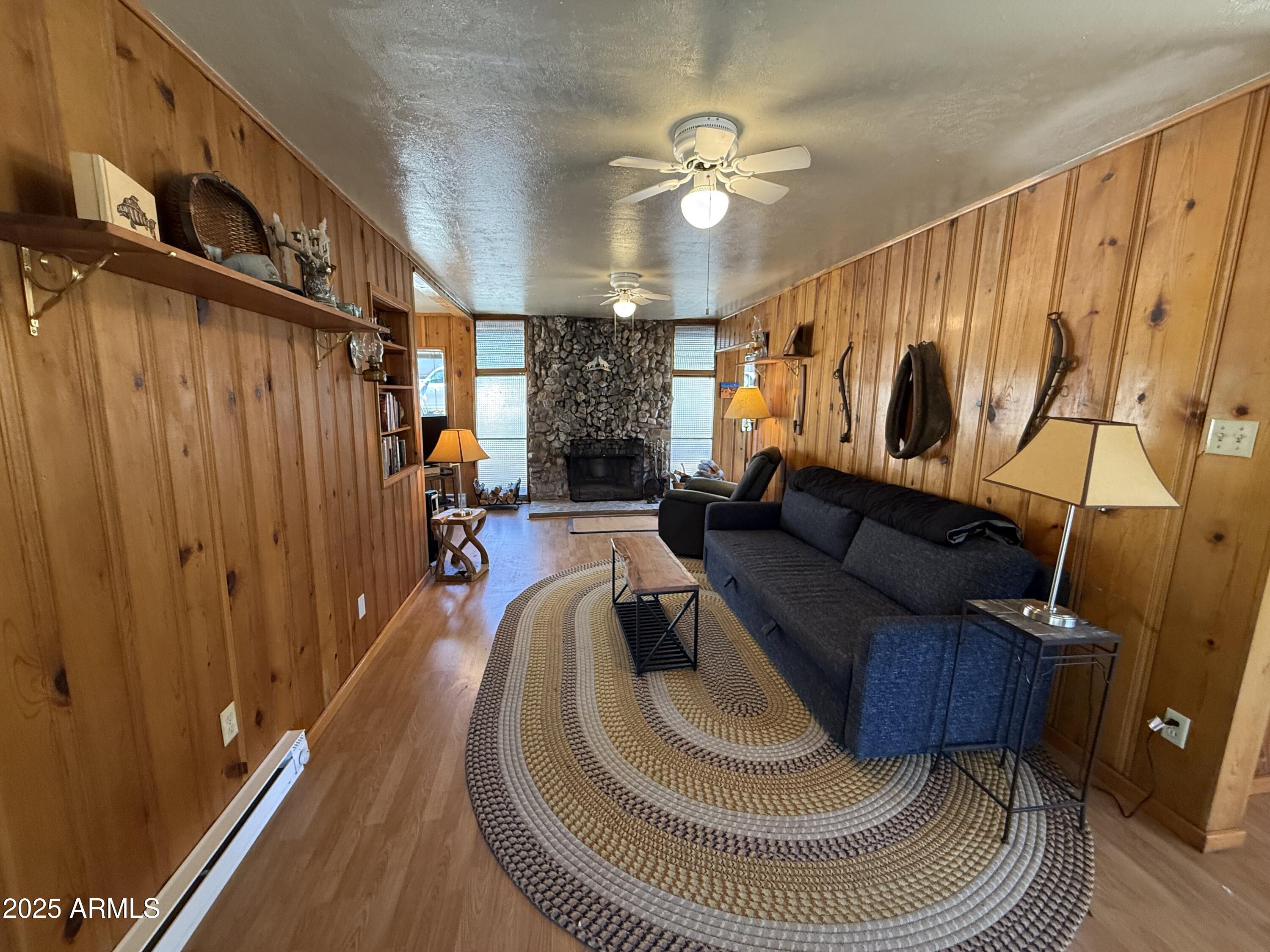 6937 Torpedo Road Crown King, AZ 86343 - Photo 22 of 23 a living room with furniture and a chandelier