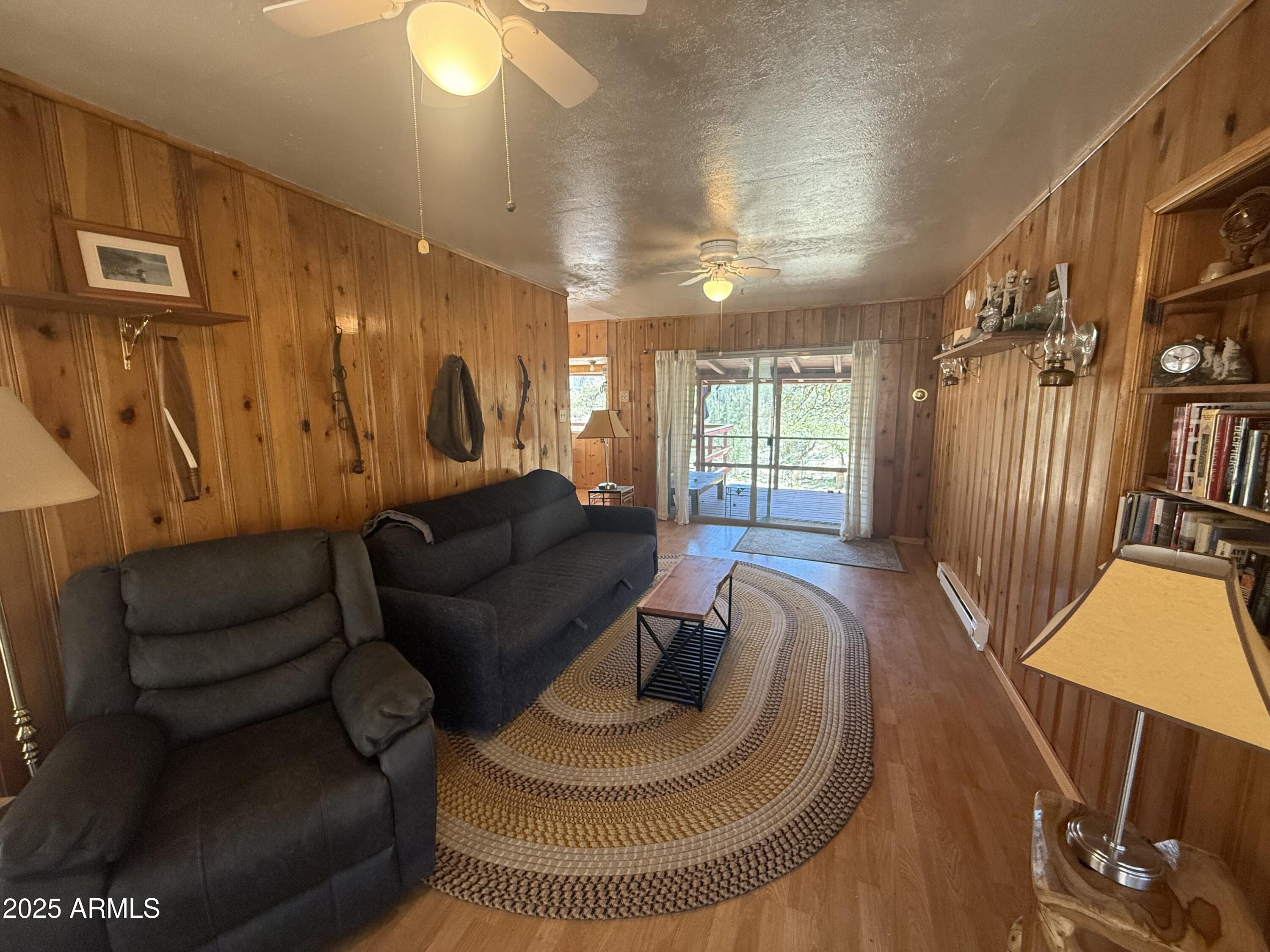 6937 Torpedo Road Crown King, AZ 86343 - Photo 3 of 23 a living room with furniture and a wooden floor