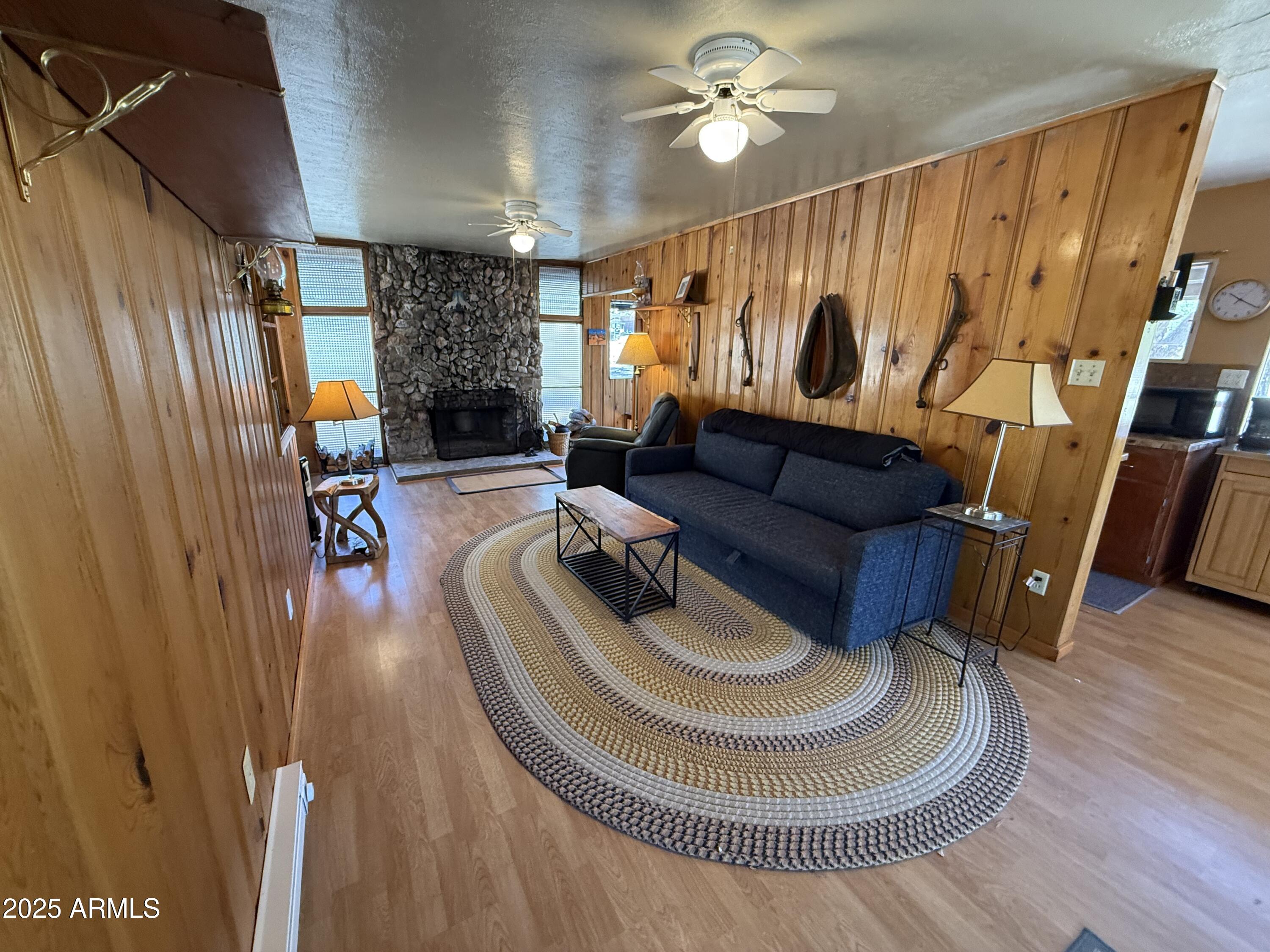 6937 Torpedo Road Crown King, AZ 86343 - Photo 5 of 23 a living room with furniture and a wooden floor