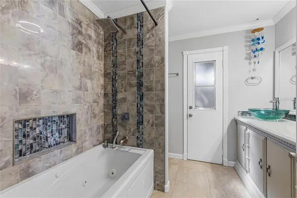 a bathroom with a bathtub and a sink