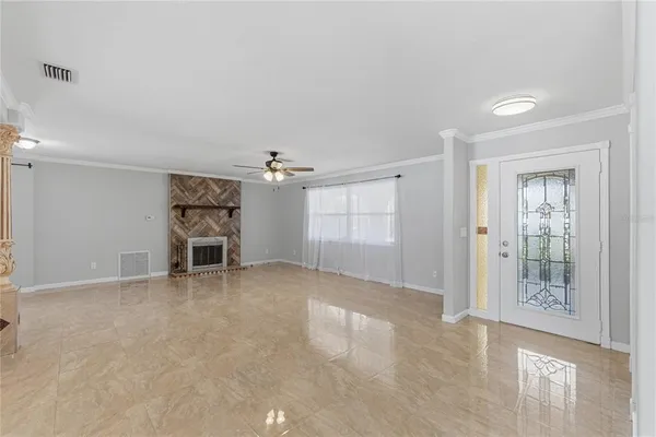 an empty room with furniture and windows