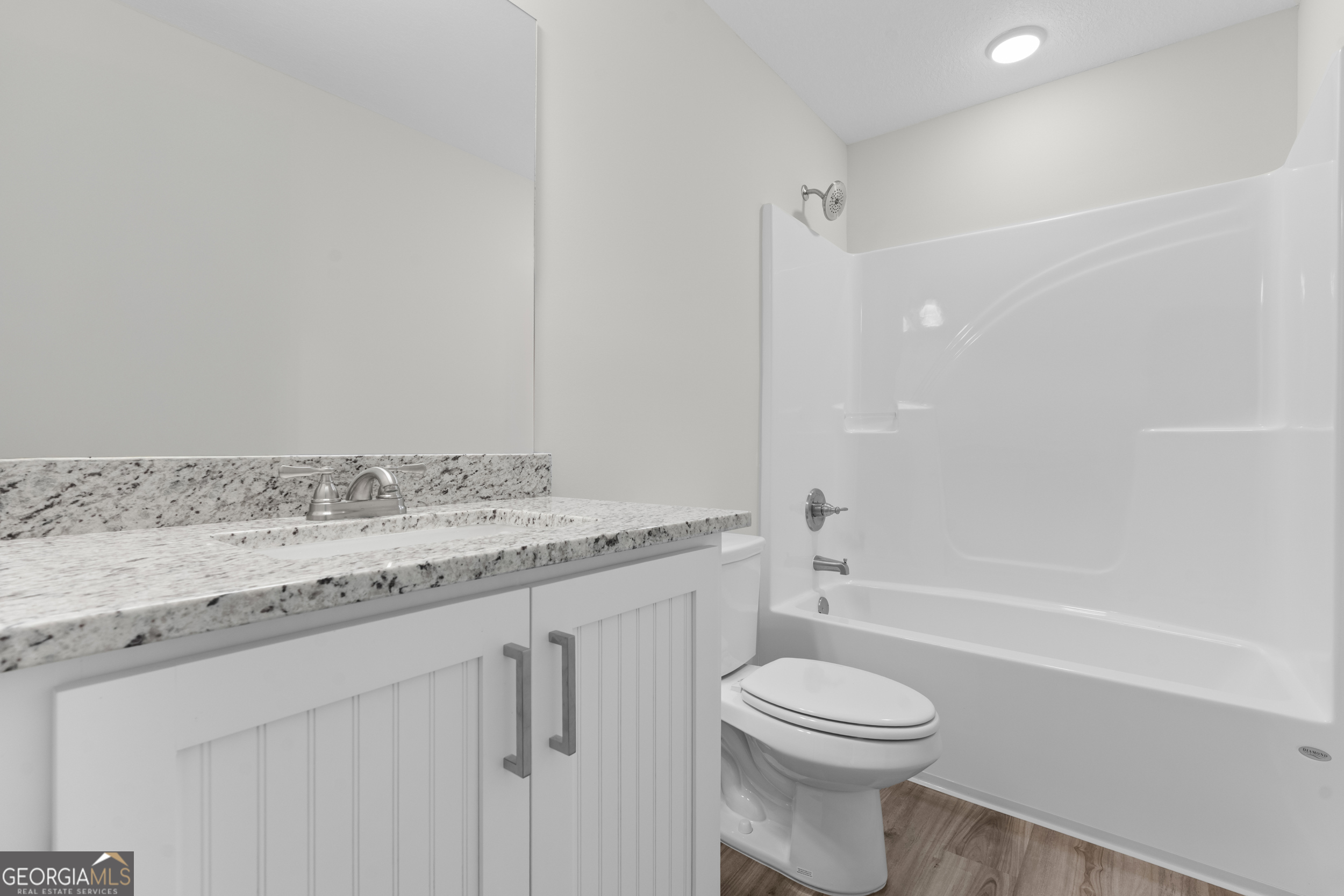 543 Jack Kennedy Road Statesboro, GA 30458 - Photo 17 of 35 a bathroom with a granite countertop sink toilet and shower