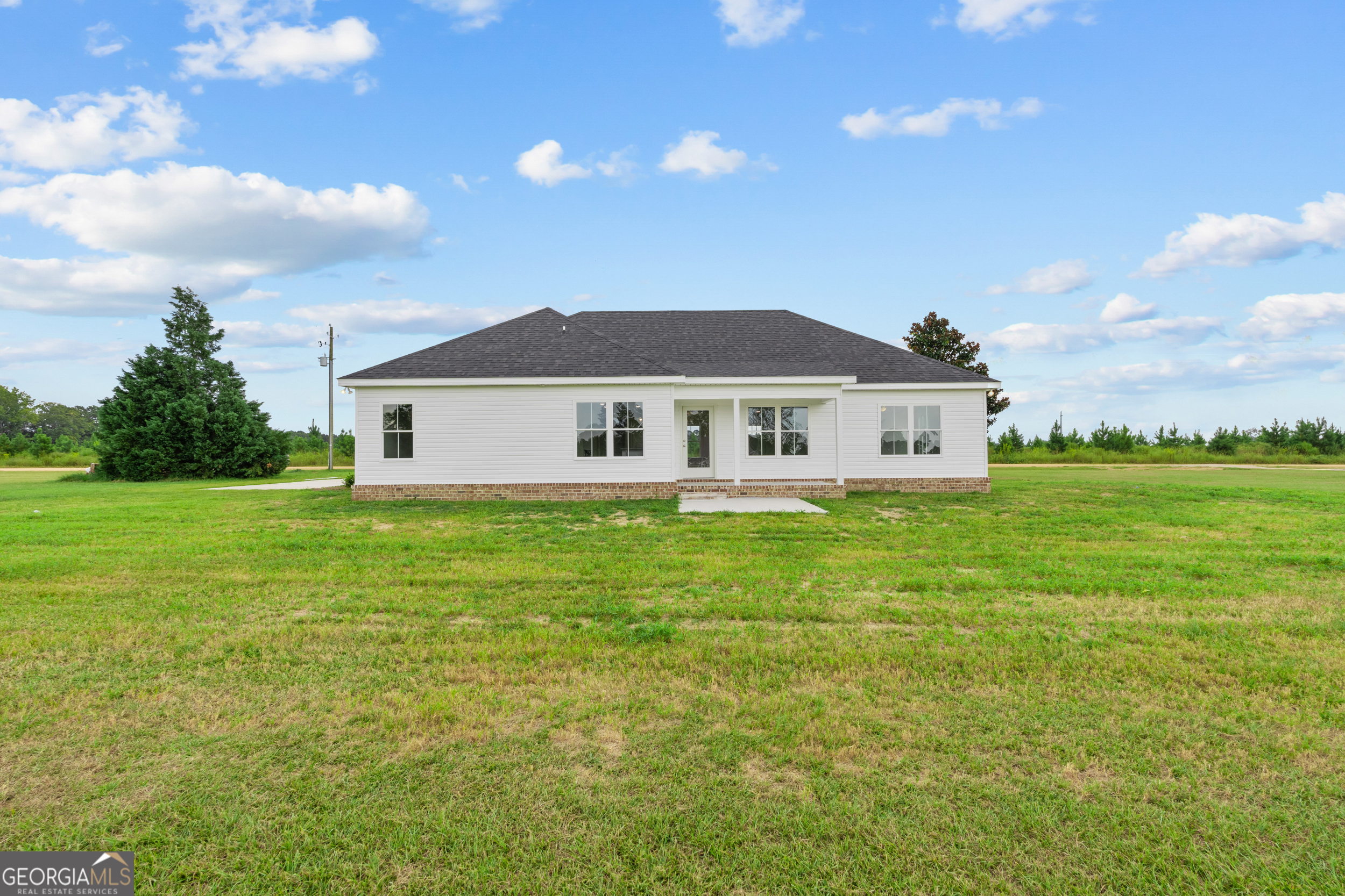 543 Jack Kennedy Road Statesboro, GA 30458 - Photo 22 of 35 a view of a house with garden and yard